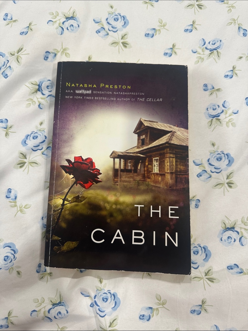 The Cabin by Natasha Preston - Dark Cover with Red Rose